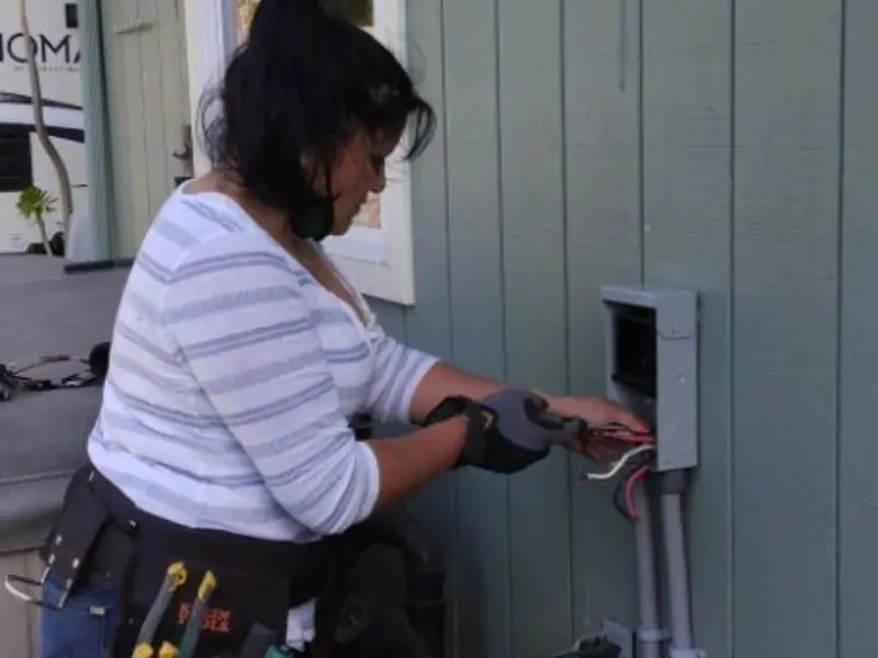 Licensed electrician wiring an exterior subpanel in Pocono
